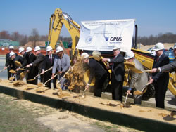 Photo showing NOAA Administrator Conrad C. Lautenbacher joining assembled dignitaries at the ground breaking of the NOAA Center for Weather and Climate Prediction.