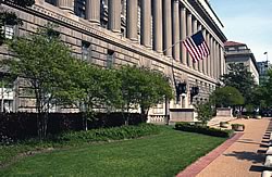 Photo showing the front of the Department of Commerce building from the left.