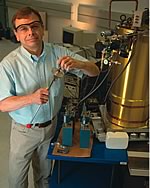Photo showing research physicist Terrence Jach preparing to analyze a sample with the NIST X-ray microcalorimeter.
